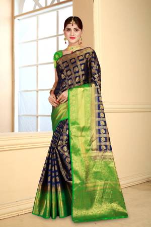 Enhance Your Personality Wearing This Art Silk Based Saree In Navy Blue Color Paired With Contrasting Green Colored Blouse. This Saree Is Durable And Also It Is Light Weight Which Is Easy To Carry All Day Long.