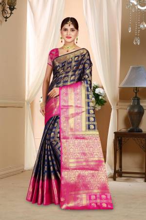 Enhance Your Personality Wearing This Art Silk Based Saree In Navy Blue Color Paired With Contrasting Pink Colored Blouse. This Saree Is Durable And Also It Is Light Weight Which Is Easy To Carry All Day Long.