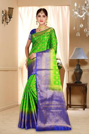 Grab This Attractive Looking Saree In Parrot Green Color Paired With Contrasting Royal Blue Colored Blouse. This Saree And Blouse Are Art Silk Based Beautified With Weave All Over It. Buy Now.