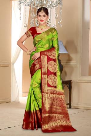 Grab This Attractive Looking Saree In  Green Color Paired With Contrasting Maroon Colored Blouse. This Saree And Blouse Are Art Silk Based Beautified With Weave All Over It. Buy Now.