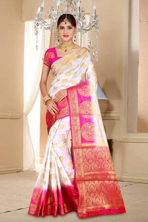 Simple And Elegant Looking Pretty Saree Is Here In White Color Paired With Contrasting Fuschia Pink Colored Blouse. This Saree And Blouse Are Art Silk Based Beautified With Weave All Over. 