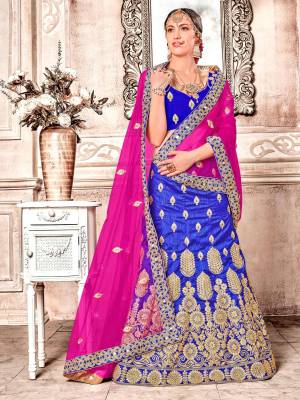Bright and Visually Appealing Color Is Here With This Heavy Designer Lehenga Choli In Royal Blue Color Paired With Contrasting Dark Pink Colored Dupatta. This Lehenga Choli Is Art Silk Based Paired With Net Fabricated Dupatta. Buy Now.