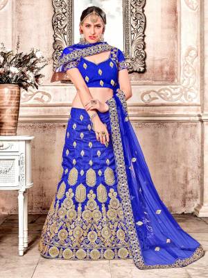 Attract All Wearing This Bright Colored Designer Lehenga Choli In Royal Blue color Paired With Royal Blue Colored Dupatta. Its Blouse And Lehenga Are Fabricated On Art Silk Paired With Net Fabricated Dupatta. Buy Now.