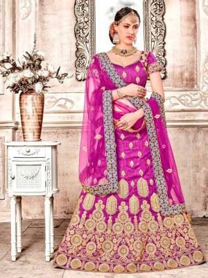 Attract All Wearing This Bright Colored Designer Lehenga Choli In Magenta Pink color Paired With Magenta Pink Colored Dupatta. Its Blouse And Lehenga Are Fabricated On Art Silk Paired With Net Fabricated Dupatta. Buy Now.
