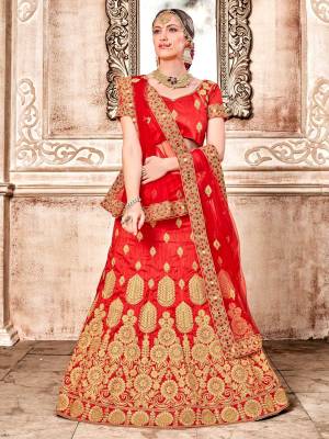 Adorn The Pretty Angelic Look Wearing This Heavy Designer Lehenga Choli In Red Color Paired With Red Colored Dupatta. Its Blouse And Lehenga Are Art Silk Based Paired With Net Fabricated Dupatta. Buy This Now.