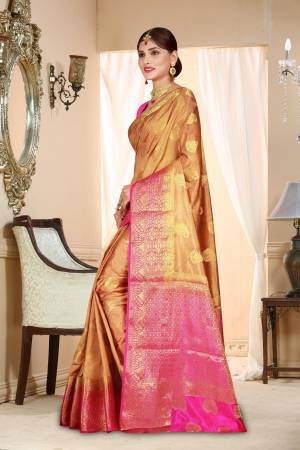 Flaunt Your Rich And Elegant Taste Wearing This Pretty Art Silk Based Saree In Light Brown Color Paired With Contrasting Pink Colored Blouse. This Saree And Blouse Are Beautified With Weave Making It More Attractive. 