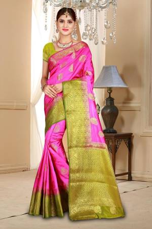 Add This Bright looking Saree In Rani Pink Color Paired With Contrasting Pear Green Colored Blouse. This Saree And Blouse Are Fabricated On Art Silk Beautified With Weave All Over It .buy Now.