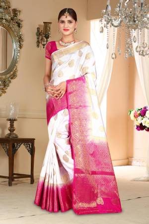 Simple And Elegant Looking Saree Is Here In White Color Paired With Dark Pink Colored Blouse. This Saree And Blouse Are Fabricated On Art Silk Beautified With Weave All Over. 