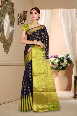 Enhance Your Personality Wearing This Art Silk Based Saree In Navy Blue Color Paired With Contrasting Green Colored Blouse. This Saree And Blouse Are Light Weight And Durable Which Is Easy To Care For.