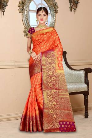 Celebrate This Festive Season Wearing This Bright And Attractive Art Silk Based Saree In Orange Color Paired With Contrasting Magenta Pink Colored Blouse. This Saree And Blouse Are Beautified With Weave All Over.