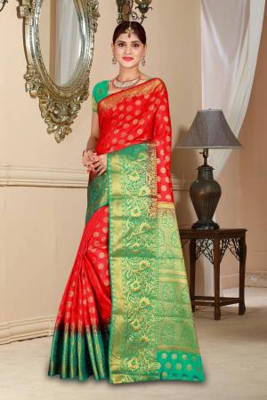 Adorn the Pretty Angelic Look Wearing This Attractive Saree In Red Color Paired With Contrasting Sea Green Colored Blouse. This Saree And Blouse Are Art Silk Based Beautified With Weave. This Saree Will Give A Rich Look To Your Personality Like Never Before.