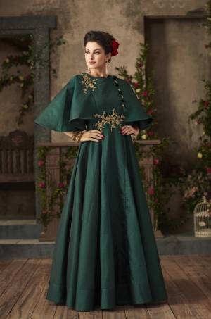 For You And Your Daughter, Grab This Designer Floor Length Gown In Pine Green Color Fabricated On Satin Silk Which Is Comfortable For Both Adult And Kids. Its New Cape Sleeve Pattern Will Earn You And Your Daughter Lots Of Compliments From Onlookers.