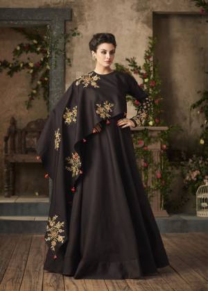 Make Your Little Princess Trendy With Yourself With This Designer Floor Length Gown In Dark Brown Color Fabricated On Satin Silk. It Has Unique One Side Cape Pattern Will Give You And Your Daughter A Look Like Never Before. Buy Now.