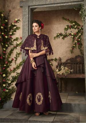A Must Have Shade For You And Your Daughter Is Here In Wine Color Fabricated On Satin Silk. Its Beautiful Cape Pattern And Embroidery Is Making The Gown More Attractive. And You And Your Daughter Will Definitely Earn Lots Of Compliments From Onlookers. 