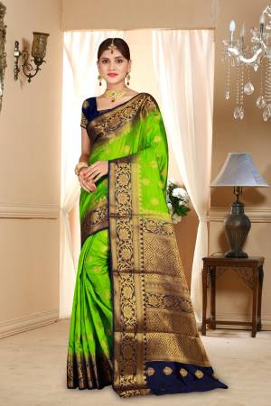 Bright And Visually Appealing Color Is Here With This Art Silk Based Saree In Parrot Green Color Paired With Contrasting Navy Blue Colored Blouse. Its Color And Weave Are Making The Saree Attractive.