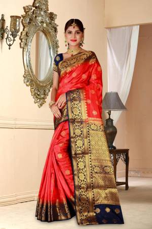 Adorn The Angelic Look This Season With This Beautiful Silk Based Saree In Red Color Paired With Contrasting Navy Blue Colored Blouse. This Saree And Blouse Are Fabricated On Art Silk Beautified With Weave All Over. 