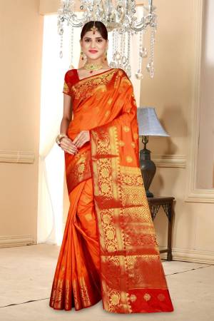 Celebrate This Festive Season Wearing This Saree In Orange Color Paired With Contrasting Red Colored Blouse. This Saree And Blouse Are Fabricated On Art Silk Beautified With Weave All Over It. Its Bright Color And Fabric Will Give  Beautiful Festive Feels.