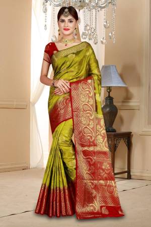 Add This Beautiful Shade In Green To Your Wardrobe With This Olive Green Colored Saree Paired With Contrasting Maroon Colored Blouse. This Saree And Blouse Are Fabricated On Art Silk Beautified With Weave All Over. Buy This Saree Now.
