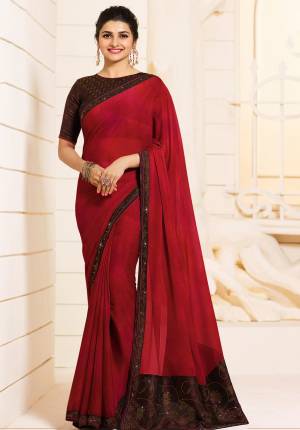 For A Royal Enhanced Look, Grab This Beautiful Designer Saree In Maroon Color Paired With Contrasting Brown Colored Blouse. This Saree Is Fabricated On Georgette Paired With Art Silk Fabricated Blouse. It Is Beautified With Stone Work Over The Blouse And SAree Lace Border.