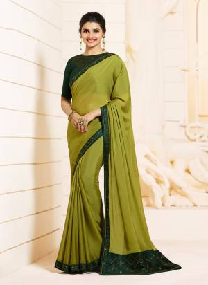 Go with The Unique Color Pallete In Green With This Designer Saree In Pear Green Color Paired With  Pine Green Colored Blouse. This Saree Is Georgette Based Paired With Art Silk Fabricated Blouse. This Color Pallete And Stone Work Will Earn You Lots Of Compliments From Onlookers.
