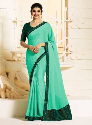 Look Pretty In This Attractive Looking Sea Green Colored Saree Paired With Teal green Colored Blouse. This Saree Is Fabricated On Georgette Paired with Art Silk fabricated Blouse. It Is  Beautified With Stone Work Over The Blouse And Lace Border.