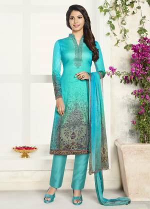 Add This Pretty Shade In Blue With This Designer Semi-Stitched Suit In Turquoise Blue Color Paired With Turquoise Blue Colored Bottom And Dupatta. Its Top IS Soft Cotton Based Paired With Cotton Bottom And Chiffon Dupatta. Buy Now.