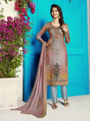 Go Colorful Wearing This Attractive Semi-Stitched Straight Suit In Multi Colored Top And Dupatta Paired With Grey Colored Bottom. Its Top IS Fabricated On Soft Cotton Paired With Cotton Bottom And Chiffon Dupatta. Buy Now.