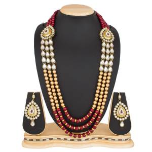 Be It A Simple Kurti Or Suit OR A Saree, This Necklace Set Is Suitable For All.Grab This Necklace Set In Beige And Maroon Color Beautified With Moti And Stone Work. Buy Now.