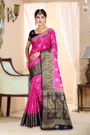 Shine Bright Wearing This Bright Rani Pink Colored Saree Paired With Contrasting Navy Blue Colored Blouse. This Saree And Blouse Are Fabricated On Art Silk Beautified With Weave All Over. It Is Light Weight And Easy To Carry All Day Long.