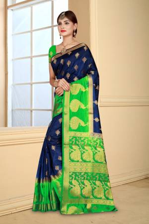 Enhance Your Personality Wearing This Silk Based Saree In Navy Blue Color Paired With Contrasting Green Colored Blouse. This Saree And Blouse are Fabricated On Art Silk Beautified With Weave All Over. Buy This Saree Now.