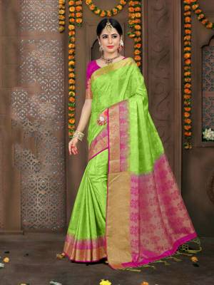 Here Is An Atttactive Looking Light Green Colored Saree Paired With Contrasting Rani Pink colored Blouse. This Saree And Blouse are Fabricated On Embossed Jacquard Which Does Not Need Any Embroidery Work. Buy Now.
