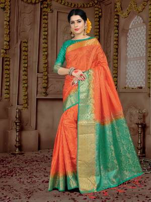This Festive Season, Grab This Beautiful Orange Colored Saree Paired With Contrasting Teal Green Colored Blouse. This Saree And Blouse are Fabricated On Embossed Jacquard. It Is Durable and Easy To Care For.