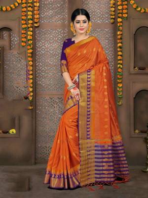 This Festive Season, Grab This Beautiful Orange Colored Saree Paired With Contrasting Dark Purple Colored Blouse. This Saree And Blouse are Fabricated On Art Silk. It Is Durable and Easy To Care For.