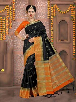 For A Bold and Beautiful Look, Grab This Saree In Black Color Paired With Orange Colored Blouse. This Saree And Blouse Are Fabricated On Art Silk Beautified with Weave All Over. 