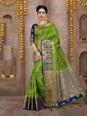 Catch All The Limelight Wearing This Silk Based Attractive Saree In Green Color Paired With Contrasting Blue Colored Blouse. This Saree And Blouse are Fabricated On Art Silk Beautified With Weave. 