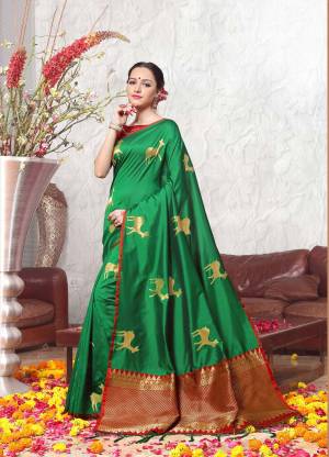 For A Proper Traditional Look, Grab This Beautiful Saree In Green Color Paired With Contrasting Maroon Colored Blouse, this Saree And Blouse Are Fabricated On Banarasi Art Silk Which Gives A Rich look To Your Personality. 