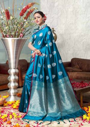Pretty Simple And Elegant Looking Saree In Here In Blue Color Paired With Blue Colored Blouse. This Saree And Blouse Are Banarasi Art Silk Fabricated Beautified With Weave All Over. 