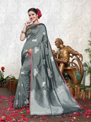 Flaunt Your Rich And Elegant Taste Wearing This Designer Silk Saree In Grey Color Paired With Grey Colored Blouse. This Saree And Blouse Are Fabricated On Banarasi Art Silk Which Is Durable and Easy To Care For.