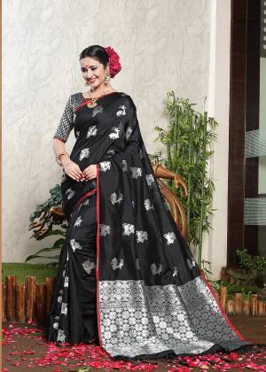 For A Bold And Beautiful Look, Grab This Designer Silk Saree In Black Color Paired With Silver And Black Colored Blouse. This Saree And Blouse Are Fabricated On Banarasi Art Silk Beautified With Weave. Buy Now.
