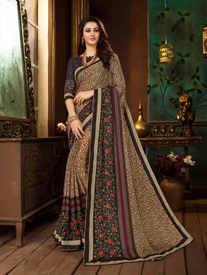 This Festive Season Adorn A Beautiful Look In Saree With This Beautiful Beige And Multi colored Saree Paired with Brown Colored Blouse. This Saree Is Fabricated On Georgette Paired With Art Silk Fabricated Blouse. It Is Beautified with Prints And Embroidery. Buy Now