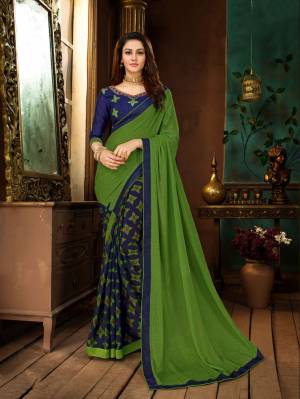 Add This Pretty Saree To Your Wardrobe In Green And Blue Color Paired With Royal Blue Colored Blouse. This Saree IS Georgette Based Paired With Art Silk Fabricated Blouse. Buy Now.