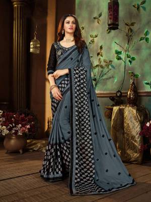 Flanut Your Rich And Elegant Taste Wearing This Designer Saree In Dark Grey Color Paired With Black Colored Blouse. This Saree Is Fabricated On Georgette Paired With Art Silk Fabricated Blouse. Buy This Saree Now.