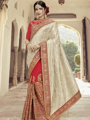 All the Fashionable women will surely like to step out in style wearing this Cream and red color silk jacquard and two tone silk saree. this gorgeous saree featuring a beautiful mix of designs. look gorgeous at an upcoming any occasion wearing the saree. Its attractive color and heavy designer embroidered saree, moti design, also heavy designer blouse, half half design saree, beautiful floral design all over work over the attire & contrast hemline adds to the look. Comes along with a contrast unstitched blouse.