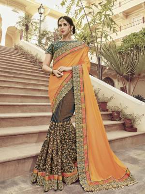 you Look striking and stunning after wearing this orange and brown color two tone satin georgette and two tone silk fabrics saree. look gorgeous at an upcoming any occasion wearing the saree. this party wear saree won't fail to impress everyone around you. Its attractive color and heavy designer embroidered saree, moti design, also heavy designer blouse, cut paste design saree, beautiful floral design all over work over the attire & contrast hemline adds to the look. Comes along with a contrast unstitched blouse.
