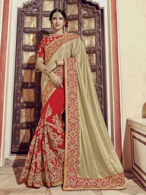 Impress everyone with your amazing Trendy look by draping this Golden and red color glitter lycra saree. this party wear saree won't fail to impress everyone around you. this gorgeous saree featuring a beautiful mix of designs. Its attractive color and heavy designer embroidered saree, moti design, also heavy designer blouse, half half design saree, beautiful floral design all over work over the attire & contrast hemline adds to the look. Comes along with a contrast unstitched blouse.