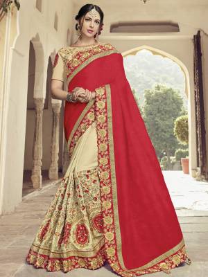 Drape this red and Cream color two tone silk fabrics saree. this gorgeous saree featuring a beautiful mix of designs. look gorgeous at an upcoming any occasion wearing the saree. Its attractive color and heavy designer embroidered saree, moti design, also heavy designer blouse, cut paste design saree, beautiful floral design all over work over the attire & contrast hemline adds to the look. Comes along with a contrast unstitched blouse.