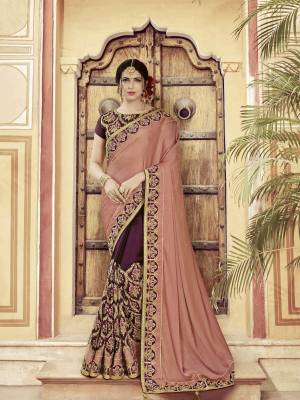 Classy, sensuous and versatile are the perfect words to describe this Dusty Pink And Wine  color two tone satin saree. Ideal for party, festive & social gatherings. this gorgeous saree featuring a beautiful mix of designs. Its attractive color and heavy designer embroidered saree, moti design, also heavy designer blouse, half half design saree, beautiful floral design all over work over the attire & contrast hemline adds to the look. Comes along with a contrast unstitched blouse.