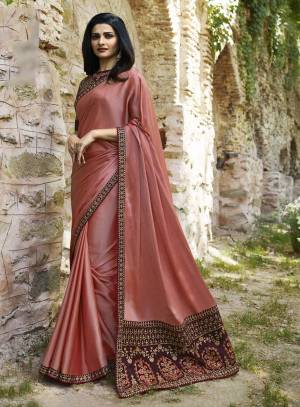 New Shade In Pink Is Here With This Designer Saree In Dusty Pink Color Paired With Contrasting Wine Colored Blouse. This Saree Is Fabricated On Soft Silk Paired With Art Silk Fabricated Blouse. Its Colors Will Definitely Earn You Lots Of Compliments From Onlookers.