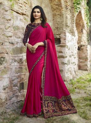 Bright And Visually Appealing Color IS Here With This Designer Saree In Dark Pink Color Paired With Contrasting Dark Purple Colored Blouse. This Saree IS Soft Silk Based Beautified With Heavy Embroidery over the Pallu. Its Fabric Ensures Superb Comfort Throughout The Gala.