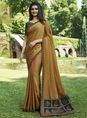 Celebrate This Festive Season Wearing This Designer Saree In Musturd Yellow Color Paired With Contrasting Green Colored Blouse. This Saree Is Soft Silk Based Paired With Art Silk Fabricated Blouse. Its Attractive Color Pallete And Embroidery Is Giving A Lovely Touch The Saree.